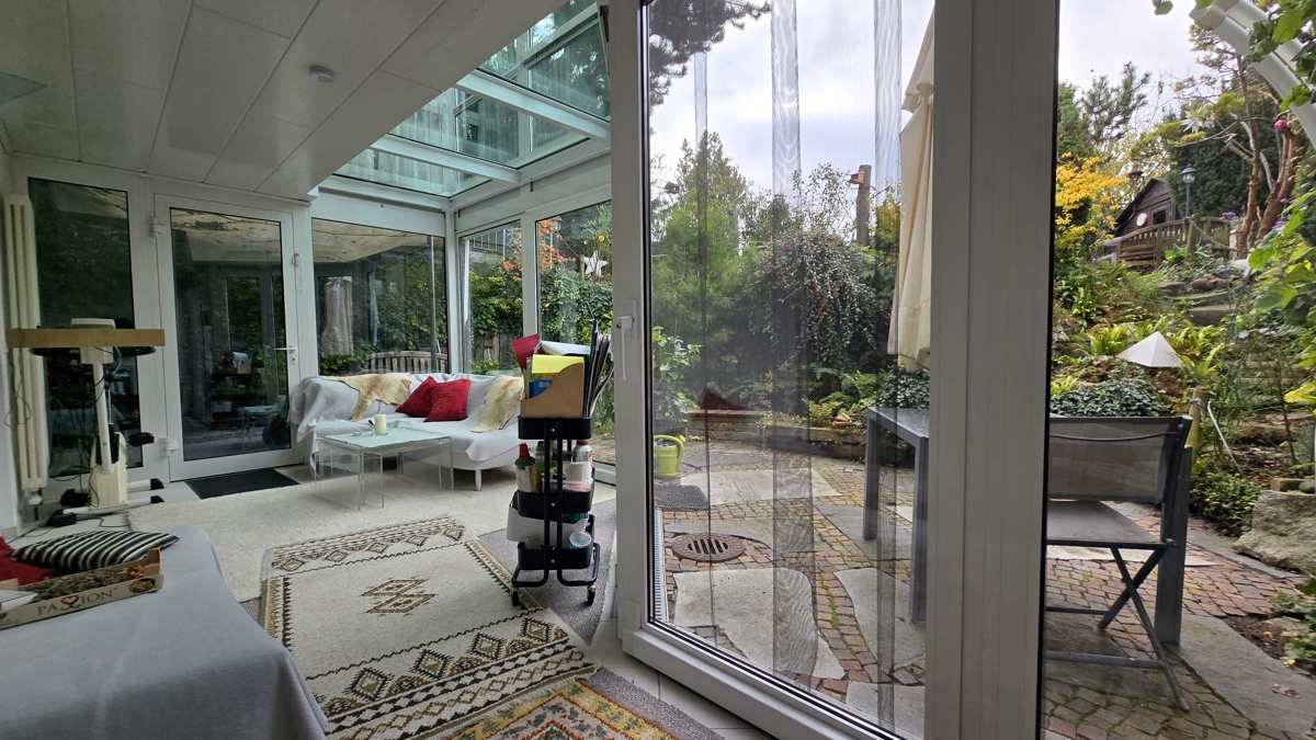 Wohnzimmer / Wintergarten im UG