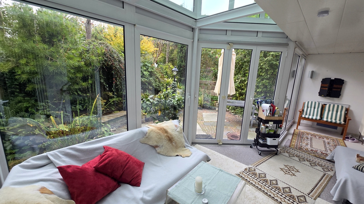Wohnzimmer / Wintergarten  im UG